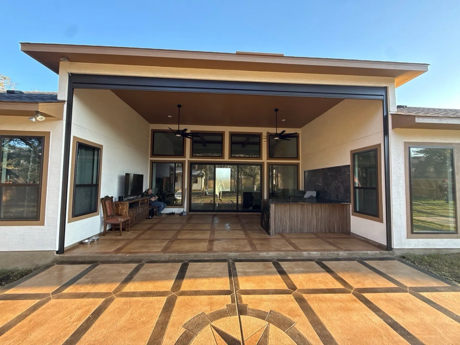 A finished TEXAN project home with the TEXAN logo on the patio