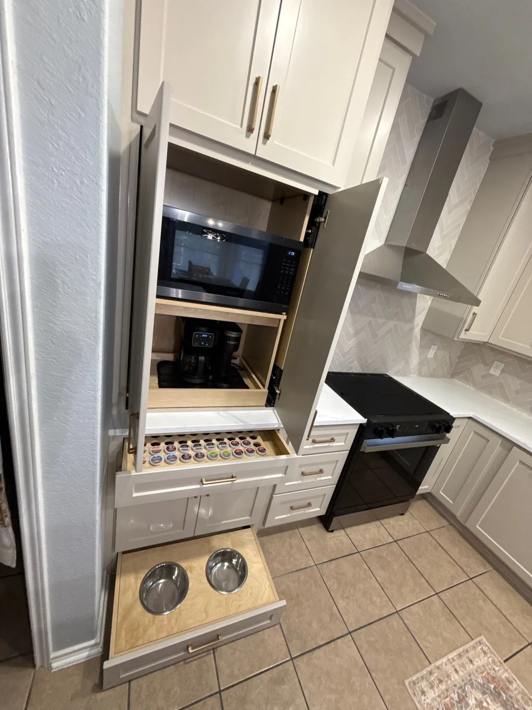 Pull-out drawer with coffee-pod storage and built-in dog bowls below