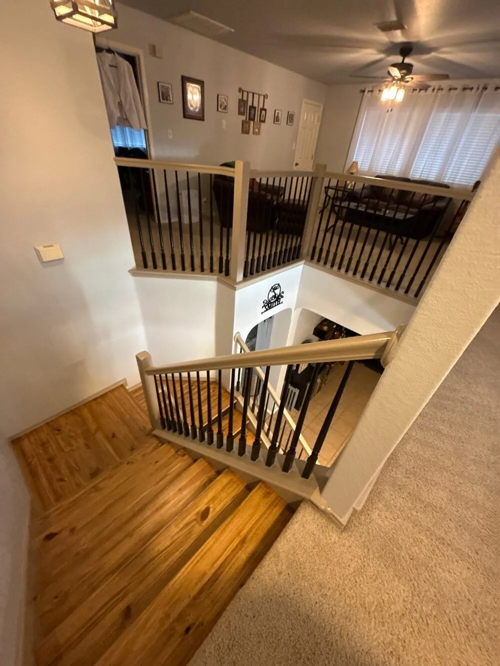 Refinished staircase and landing with wood treads and new balusters