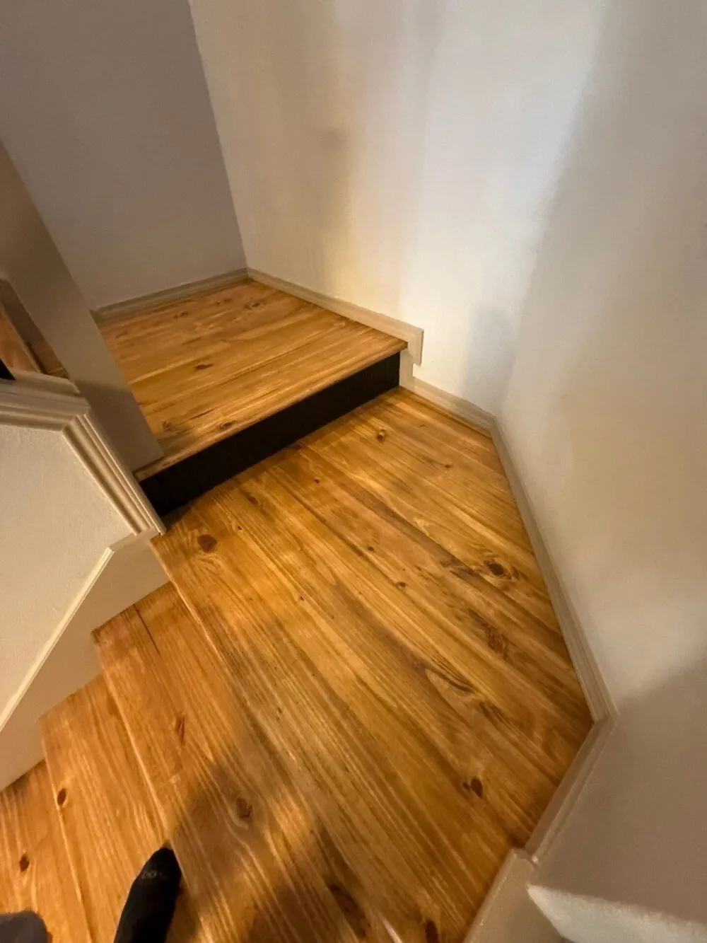 Wood treads carried up onto the landing